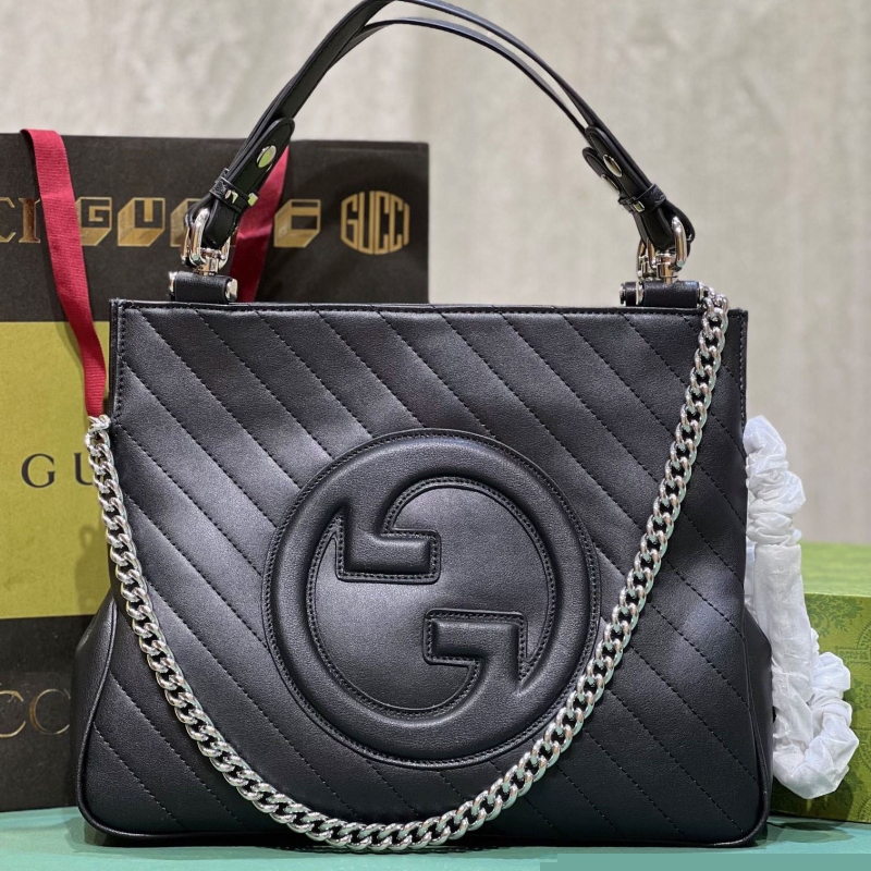 G*u*i shopping bags